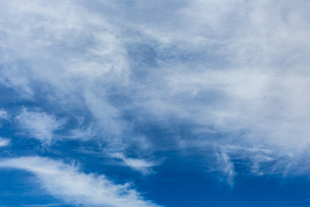 Cirrus and Stratus clouds in dramatic blue sky over Cape Town South Africaの写真素材