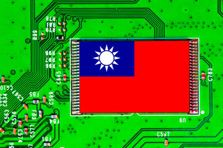Taiwanese National Flag overlaid on PC micro chip on integrated circuit boardの写真素材