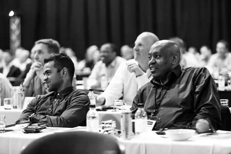 Johannesburg, South Africa - October 22, 2014: Delegates attending a sales convention in large conference hallのeditorial素材