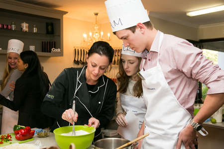 Johannesburg, South Africa - June 10, 2015: Diverse young people at team building cooking classのeditorial素材