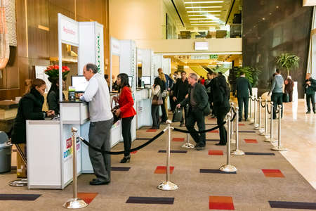 Johannesburg, South Africa - June 25, 2014: Delegates registering at sign in booth for sales...