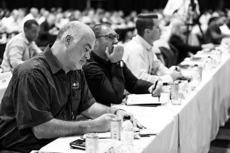 Johannesburg, South Africa - October 22, 2014: Delegates attending a sales convention in large...
