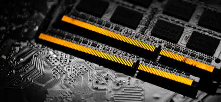 Macro Close up of computer RAM chip and motherboard on dark background