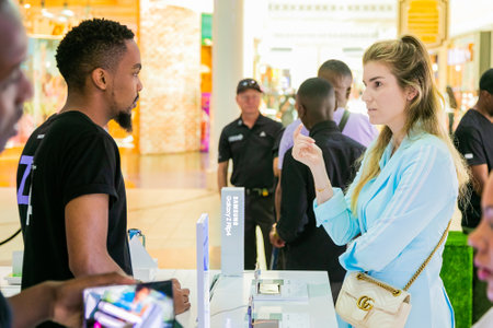 Cape Town, South Africa - October 29, 2022: Customer shopping for mobile phone in retail storeのeditorial素材