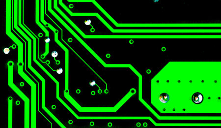Macro Close up of printed wiring on green PC circuit board