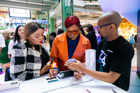 Cape Town, South Africa - October 22, 2022: Customer shopping for mobile phone in retail store