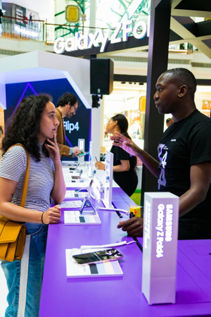 Cape Town, South Africa - October 22, 2022: Customer shopping for mobile phone in retail storeのeditorial素材