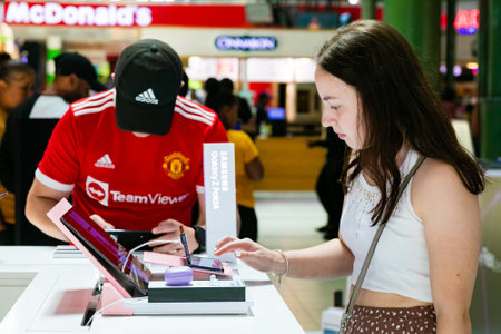 Cape Town, South Africa - October 22, 2022: Customer shopping for mobile phone in retail storeのeditorial素材