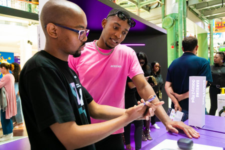 Cape Town, South Africa - October 22, 2022: Customer shopping for mobile phone in retail store
