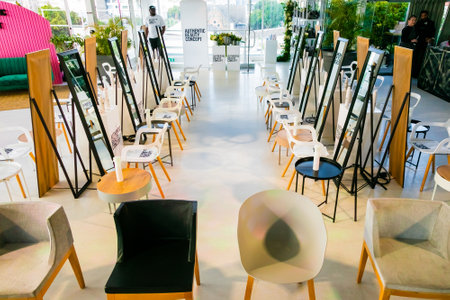 Cape Town, South Africa - November 15, 2022: Empty professional hair salon with large mirrors