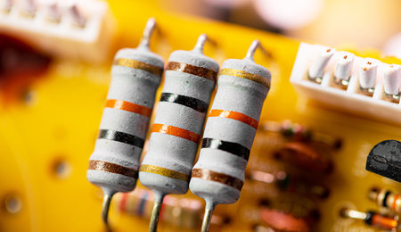Macro Close up of components and microchips on old PC circuit board.