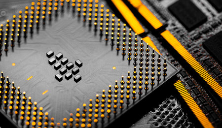 Macro Close up of RAM Memory and pins on Main CPU PC processor circuit board.