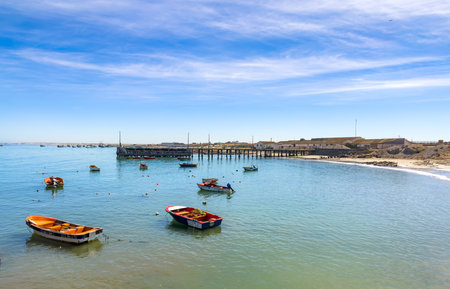 Port Nolloth, South Africa - March 16, 2024: Small fishing rowboats in harbour in coastal townのeditorial素材