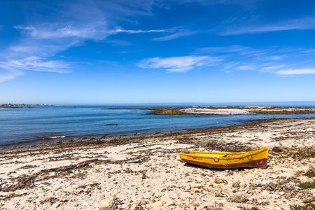 Port Nolloth, South Africa - March 16, 2024: Small fishing rowboat on a beach in coastal townのeditorial素材