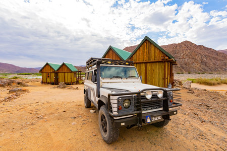 Richtersveld, South Africa - March 12, 2024: Old Land Rover Defender parked at a campsite in arid regionのeditorial素材