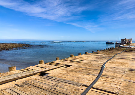 Port Nolloth, South Africa - March 16, 2024: Old jetty harbour in small coastal townのeditorial素材