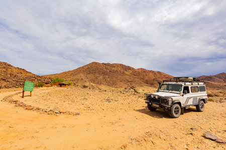 Richtersveld, South Africa - March 12, 2024: Old Land Rover Defender parked at a campsite in arid regionのeditorial素材