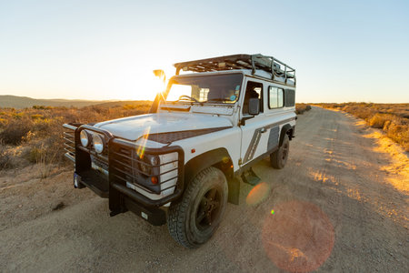 Namaqualand, South Africa - March 9, 2024: Old Land Rover Defender parked on a gravel road in arid regionのeditorial素材