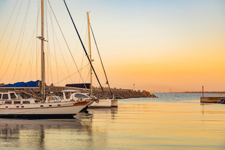 Scene of leisure yacht sailboats docked at small harbour in Cape Town at sunsetの写真素材