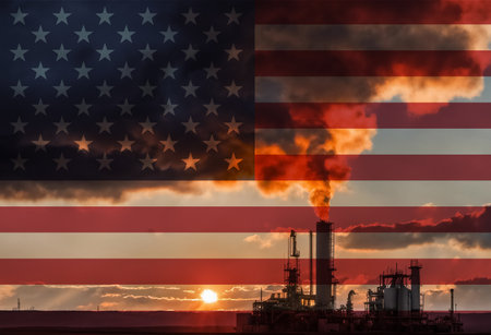 Natural Gas drilling rig with American flag overlay symbolising natural resources in countryの写真素材
