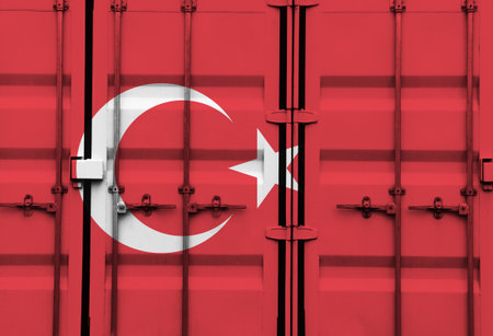 Shipping container with Turkish national flag overlay symbolising tariffs and international trade policies in global commerce contextの写真素材
