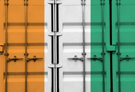 Shipping container with Ivory Coast national flag overlay symbolising tariffs and international trade policies in global commerce contextの写真素材