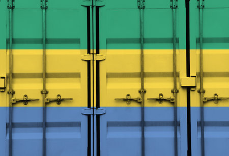 Shipping container with Gabon national flag overlay symbolising tariffs and international trade policies in global commerce contextの写真素材