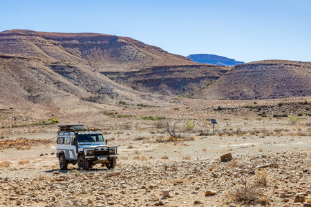 Karoo, South Africa - October 27, 2025: Old Land Rover Defender parked in an arid regionのeditorial素材