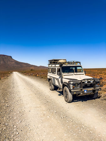 Karoo, South Africa - October 27, 2025: Old Land Rover Defender parked in an arid regionのeditorial素材