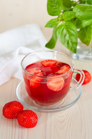 Herbal tea with strawberries, wooden backgroundの写真素材
