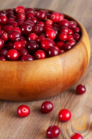 Fresh cranberry in wooden bowlの写真素材