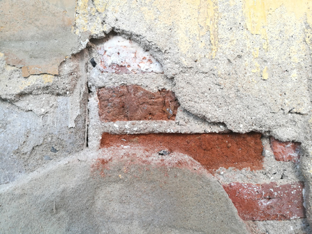 Old cement wall and peeling paint dirty concrete backgroundの写真素材