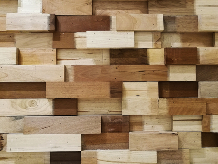 wooden blocks stacked as wall texture for backgroundの写真素材