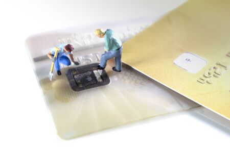 Credit Cards Theft Concept. Hacker steal Credit Cards  information on ship card Usecurity  For Unauthorized Shopping. Unauthorized Payments on white backgroundの写真素材
