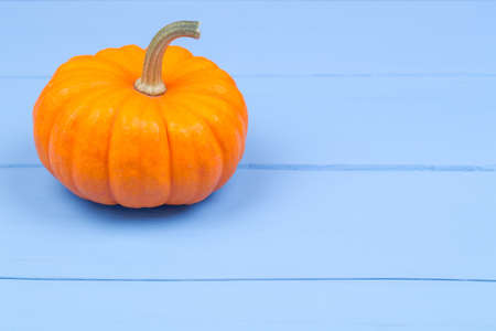 Pumpkins on a wooden table, on an blue wooden tableの写真素材
