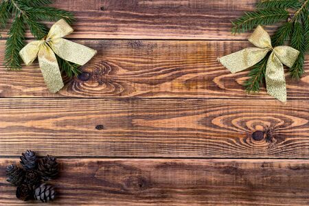 Christmas decoration on a brown wooden background for your congratulationの写真素材