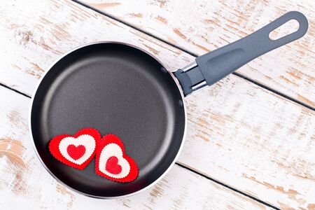 Frying pan with red hearts, top viewの写真素材