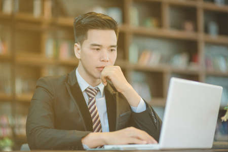 Successful entrepreneurs and business people achieving goals, Happy business people celebrating success at company, Business man with arms up leading a successful team.の写真素材