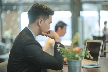 Successful entrepreneurs and business people achieving goals, Happy business people celebrating success at company, Business man with arms up leading a successful team.の写真素材