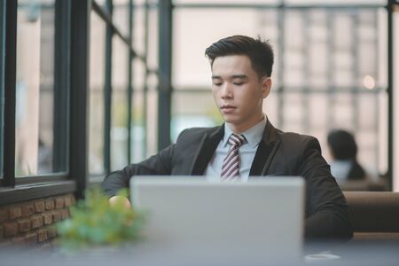 Successful entrepreneurs and business people achieving goals, Happy business people celebrating success at company, Business woman with arms up leading a successful team.の写真素材