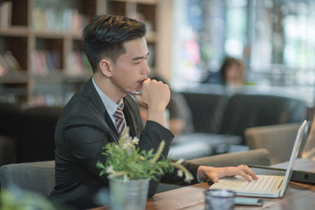 Successful entrepreneurs and business people achieving goals, Happy business people celebrating success at company, Business man with arms up leading a successful team.の写真素材