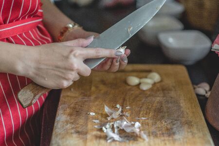 Chef prepares meals at the table in the kitchenの写真素材