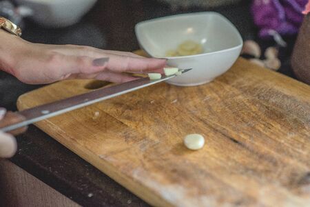 Chef prepares meals at the table in the kitchenの写真素材
