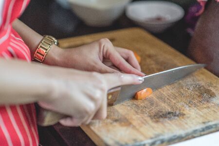 Chef prepares meals at the table in the kitchenの写真素材