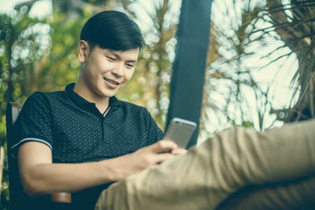 The man holding a phoneの写真素材