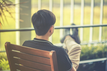Man sitting on benchの写真素材