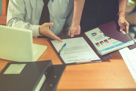Group of business people analysis with marketing report graph, Young specialists are discussing...