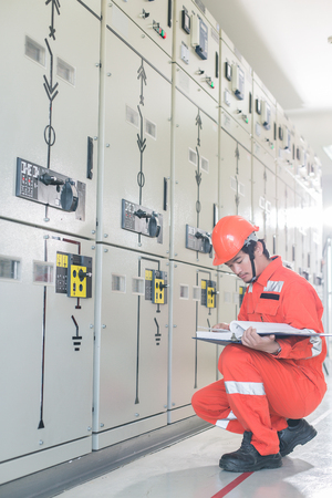 Engineers are checking the electrical system. Selective focus. Engineers and executives are...