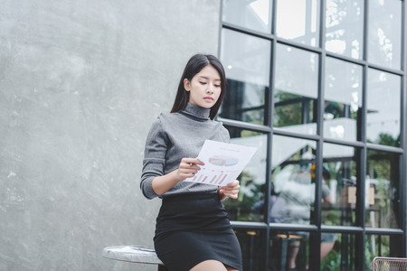 Modern business woman in the office with copy space, smiling business woman. Middle age beautiful and smiling business woman. Selective focusの写真素材