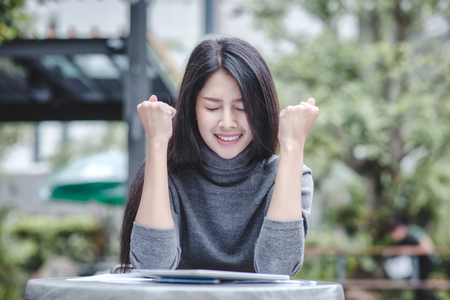 Happy business people celebrating success at company, Business owners are excited. Businesses achieve their goals.の写真素材